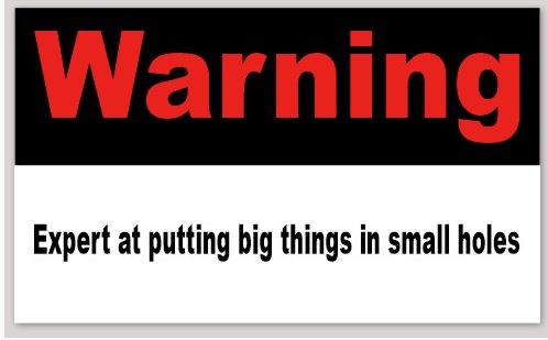 Warning Sign Expert at putting big things in small holes